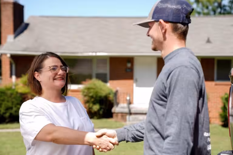 Foundation repair specialist shaking hands with a happy customer in Milwaukee, WI
