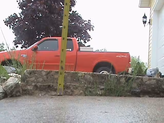 A walkway in front of a home that has settled a few inches and created a tripping hazard