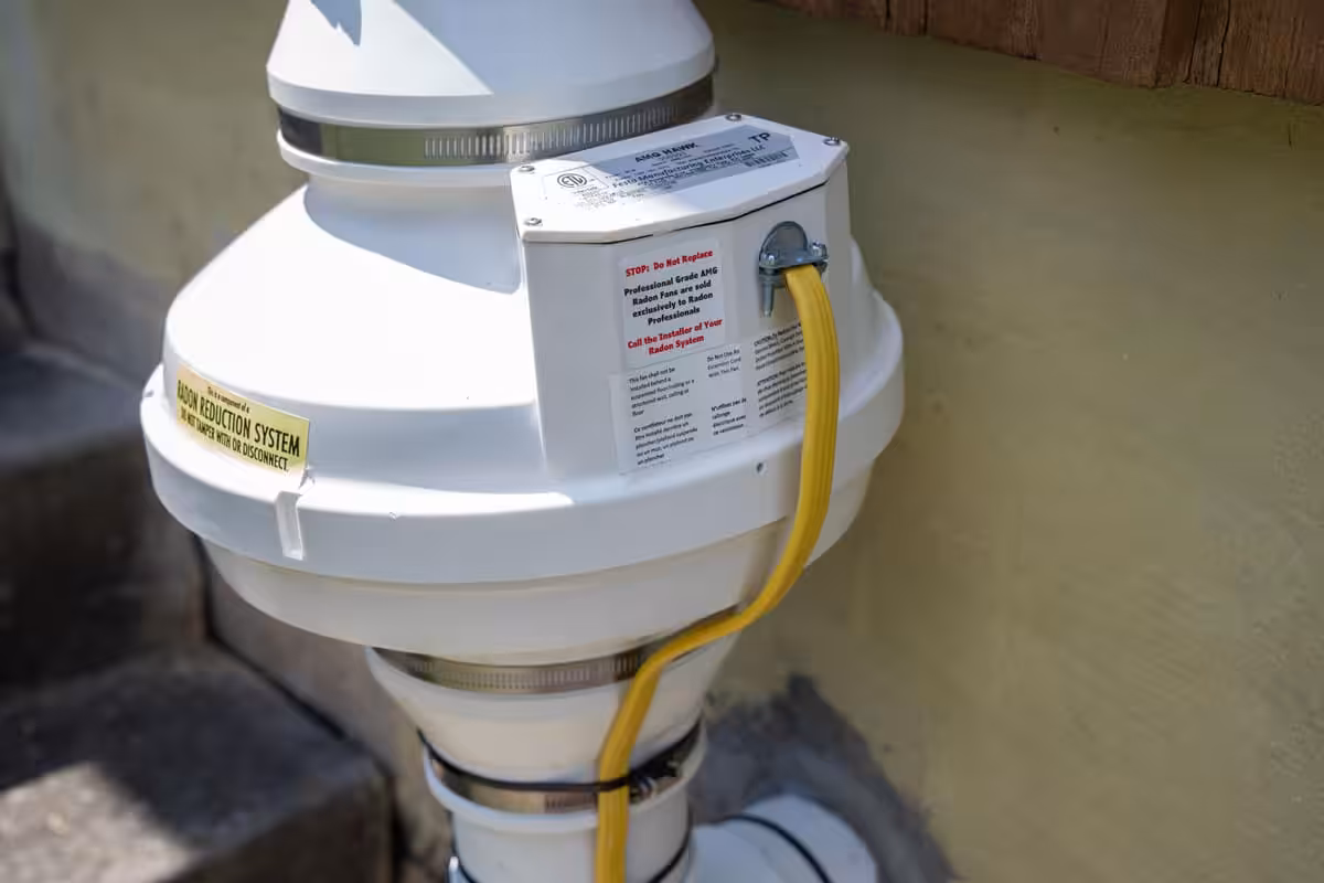 An outdoor component of a radon mitigation system