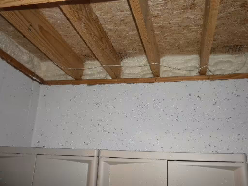 Spray foam insulation in a basement around the perimeter walls