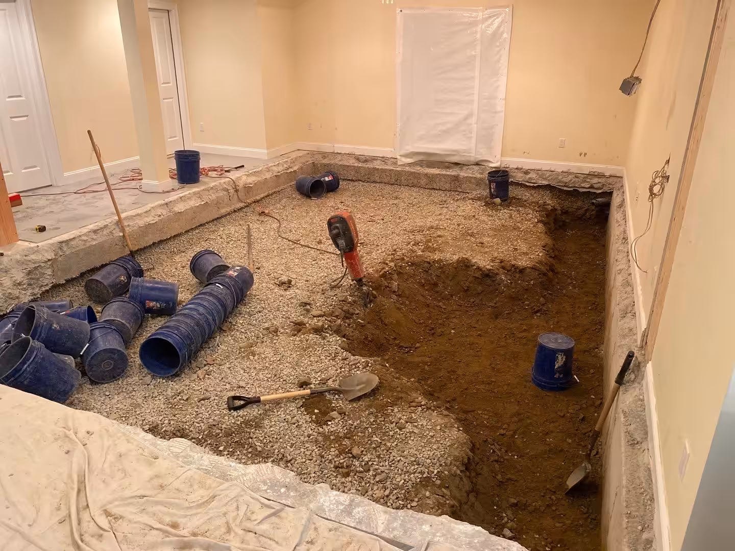 Basement lowering or dig out in progress to increase headspace in a home's basement