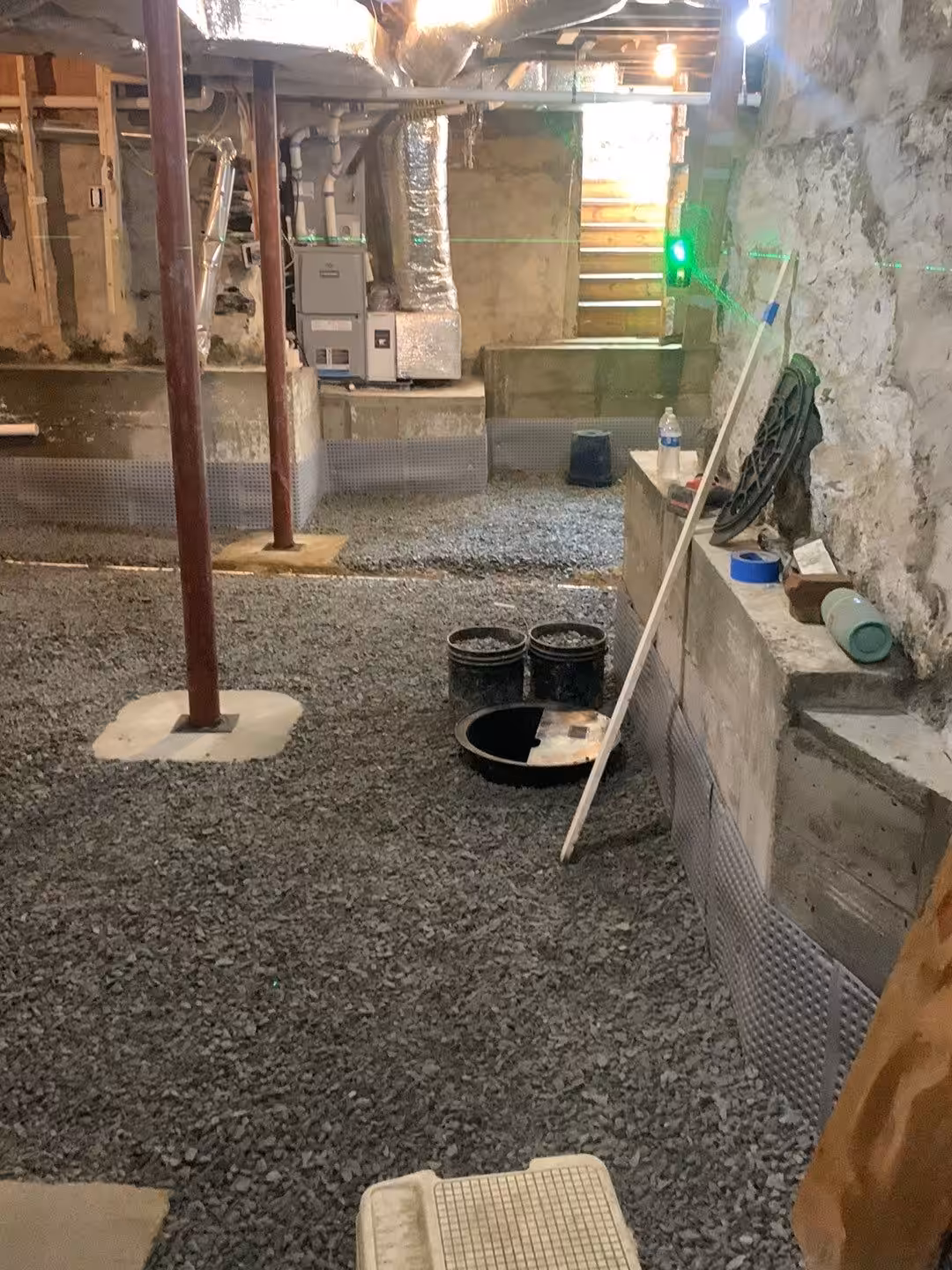 Laser leveling used during a basement lowering project